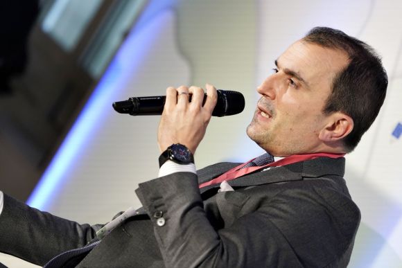 Anguel Beremliysky, a project manager at the Commission, speaks on stage. 